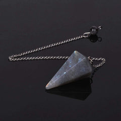 Angelstones natural rock crystal pendulum detail for Reiki energy work.