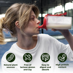 Angtai JN pea protein shake being poured into a glass.