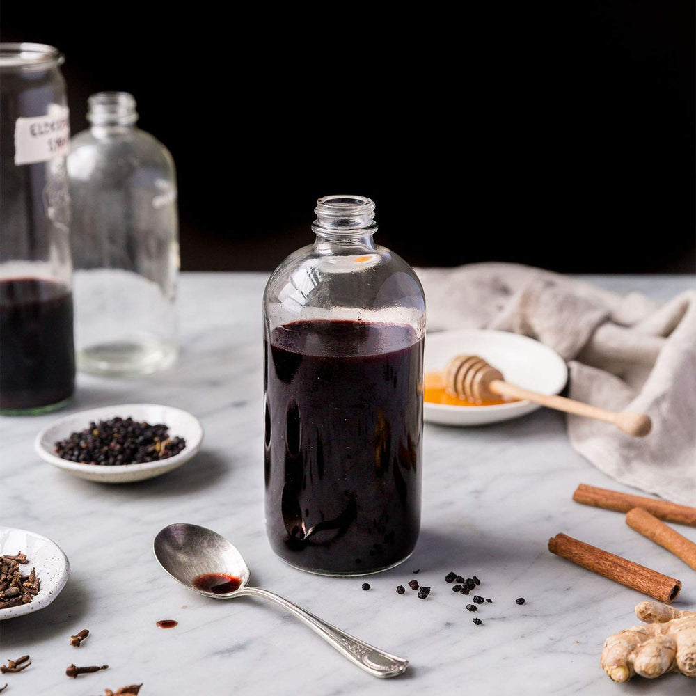 Anima Mundi Black Elderberry Syrup glass-on-counter ready for tea