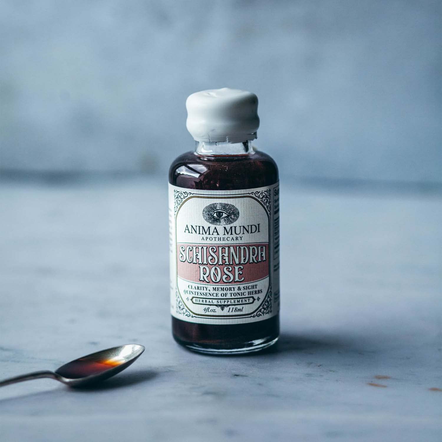 Anima Mundi Bottle with tea cup illustrating easy daily ritual integration.