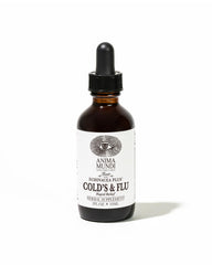 Anima Mundi Cold's & Flu Tonic bottle beside steaming tea for immune support.