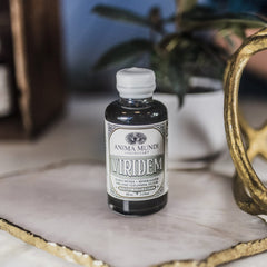 2 oz Viridem Greens Detox Elixir packaging on a clean surface for convenient daily use