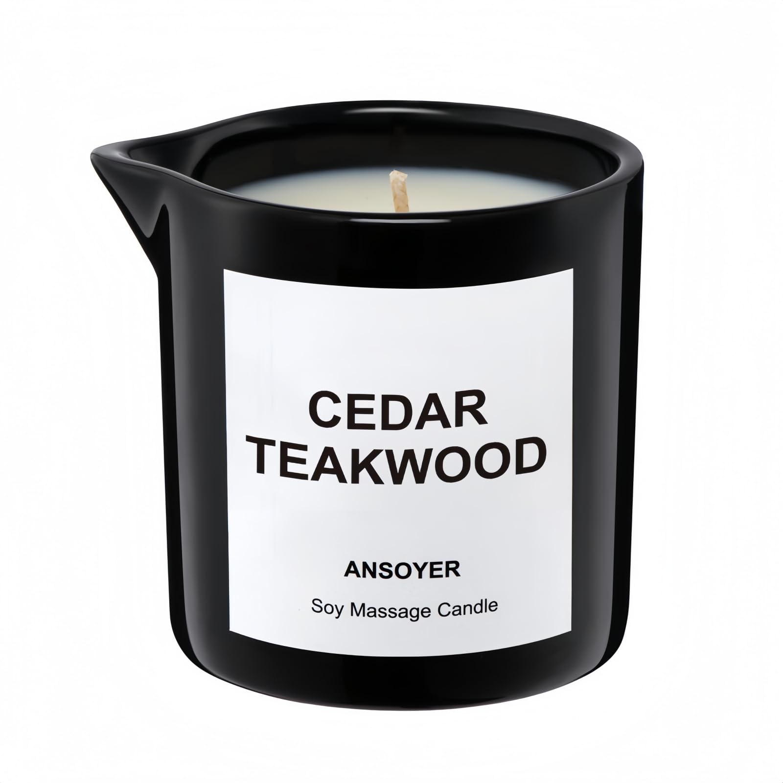 ANSOYER massage oil candle bottle in cedar-teakwood scent for skin hydration.