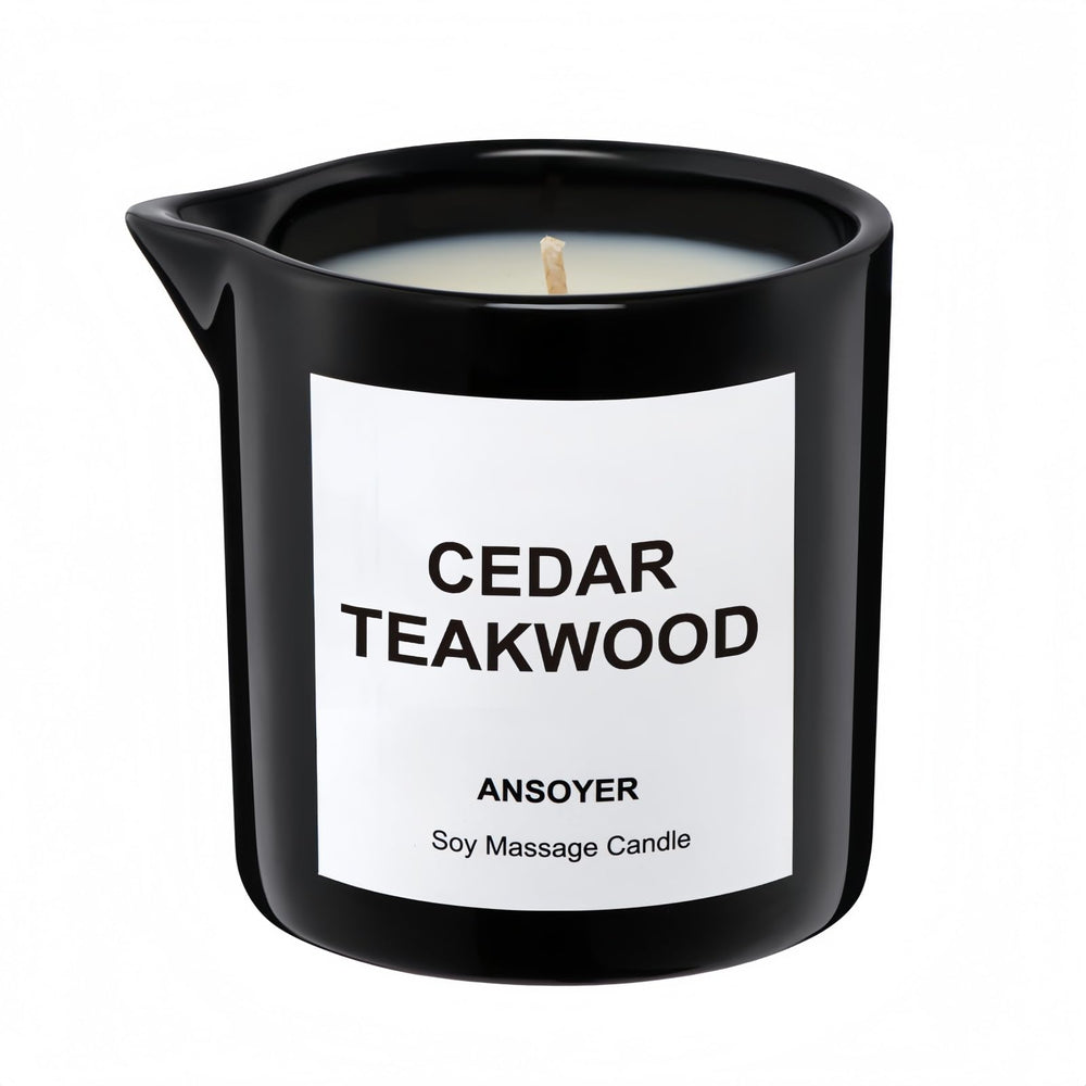 ANSOYER massage oil candle bottle in cedar-teakwood scent for skin hydration.