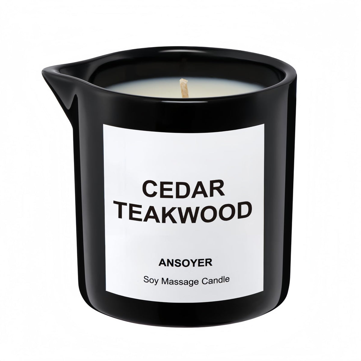 ANSOYER massage oil candle bottle in cedar-teakwood scent for skin hydration.