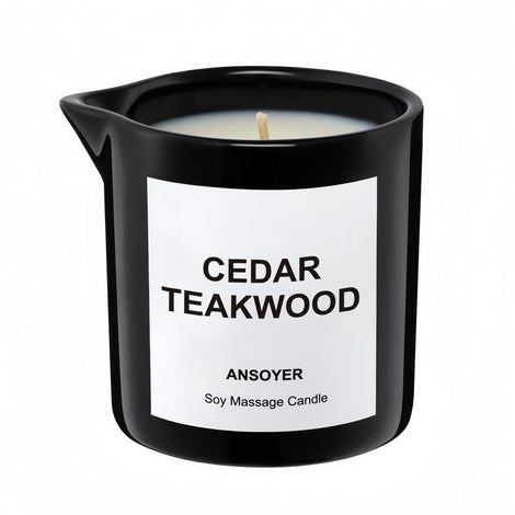 ANSOYER massage oil candle bottle in cedar-teakwood scent for skin hydration.
