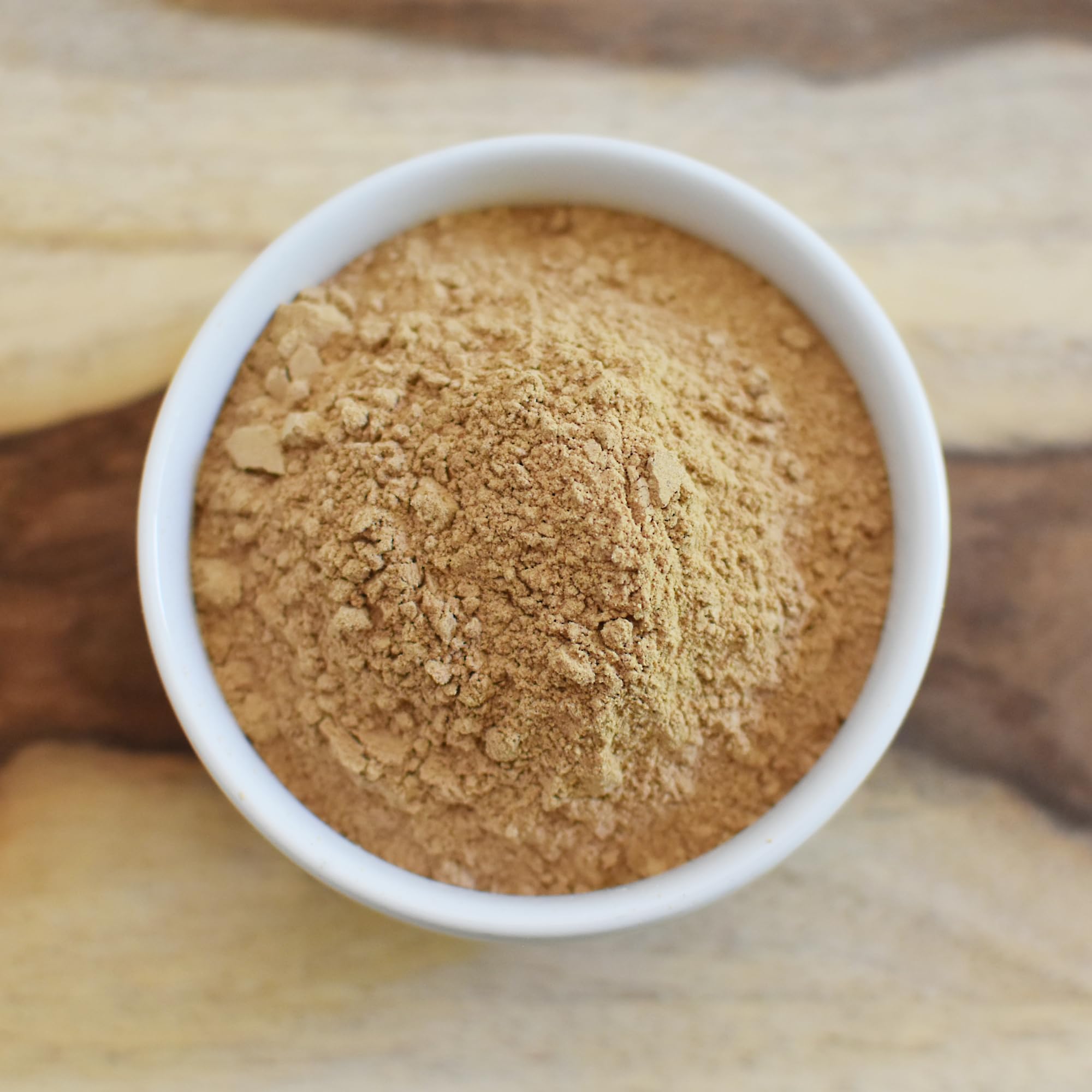 Anthony's Maca powder being poured into a glass for a smoothie