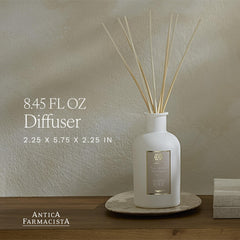Antica Farmacista reed diffuser closeup with signature reeds dispersing fragrance.