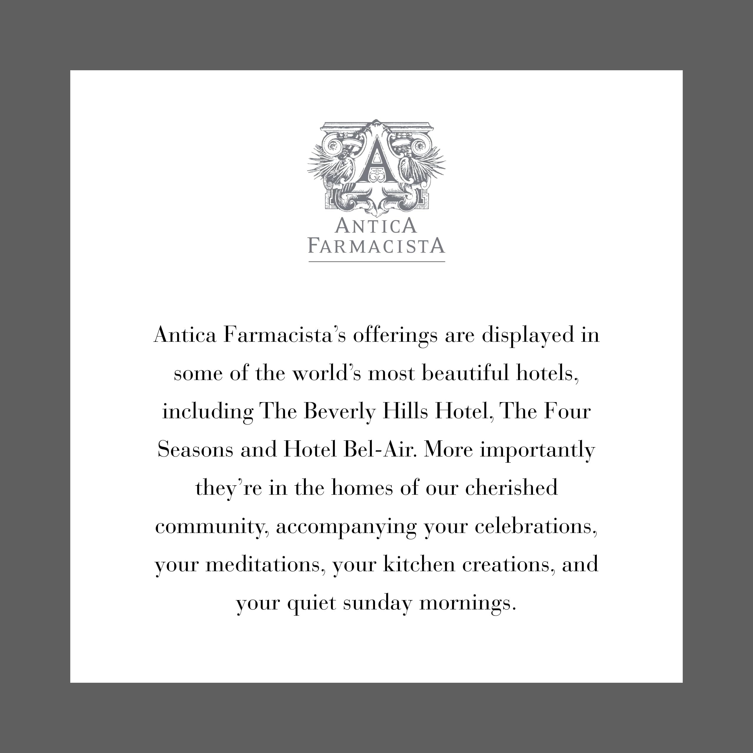 Antica Farmacista candle in a room setting with soothing glow.
