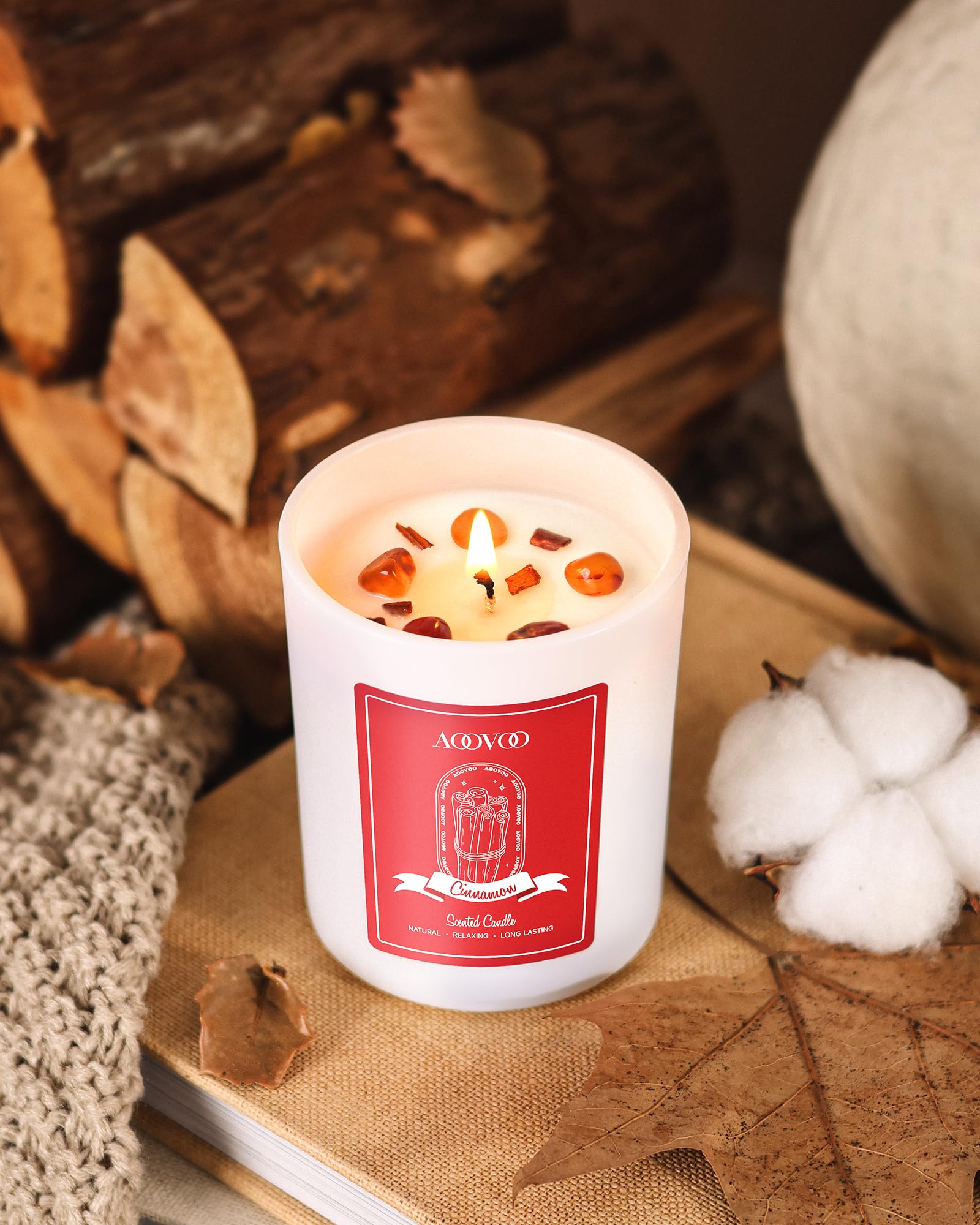 Candle interior reveals red agate crystal for grounding energy.
