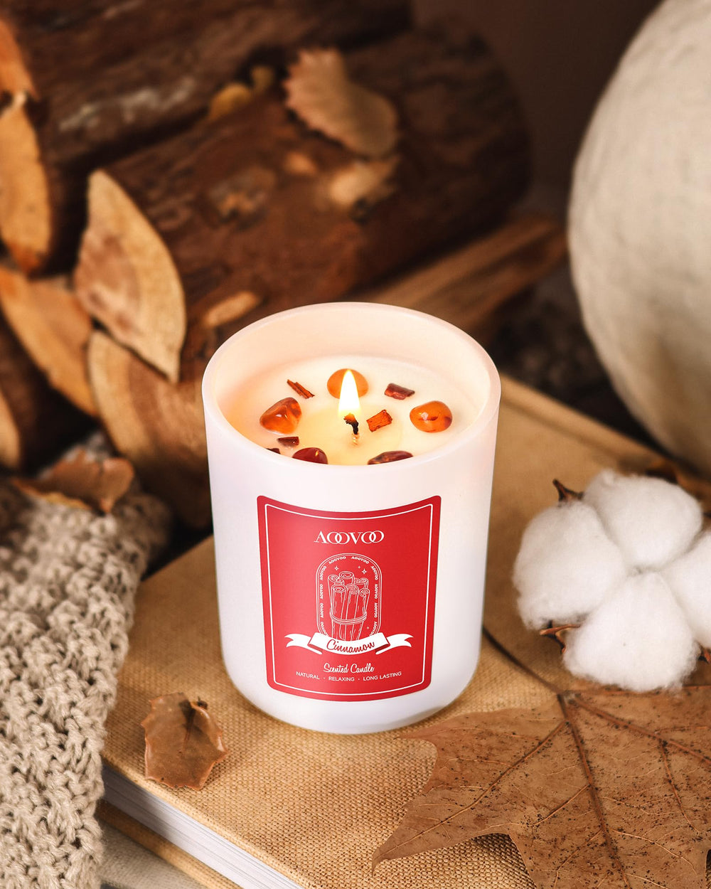 Candle interior reveals red agate crystal for grounding energy.