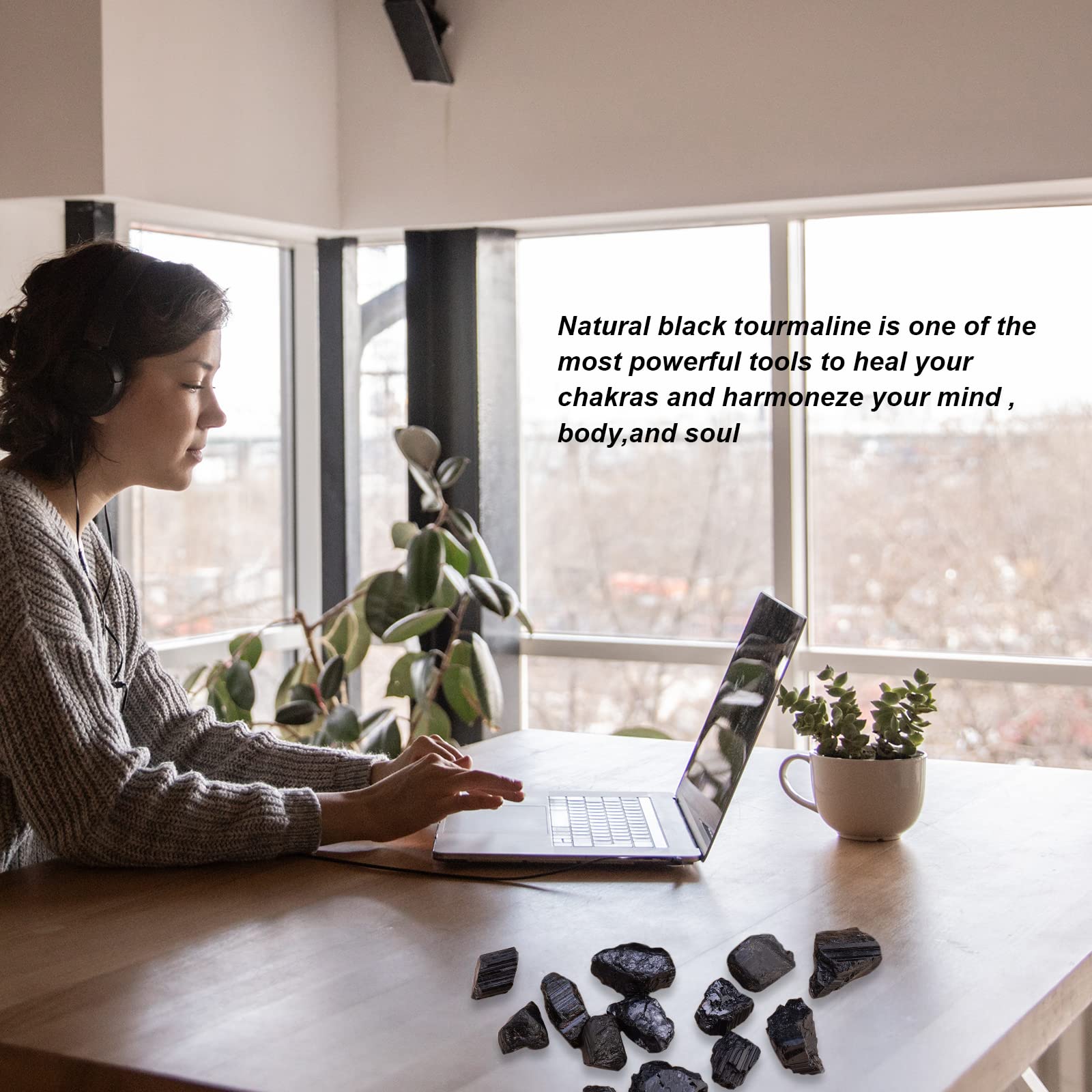 Apengshi Black Tourmaline raw stone on a desk may help absorb ambient negativity.