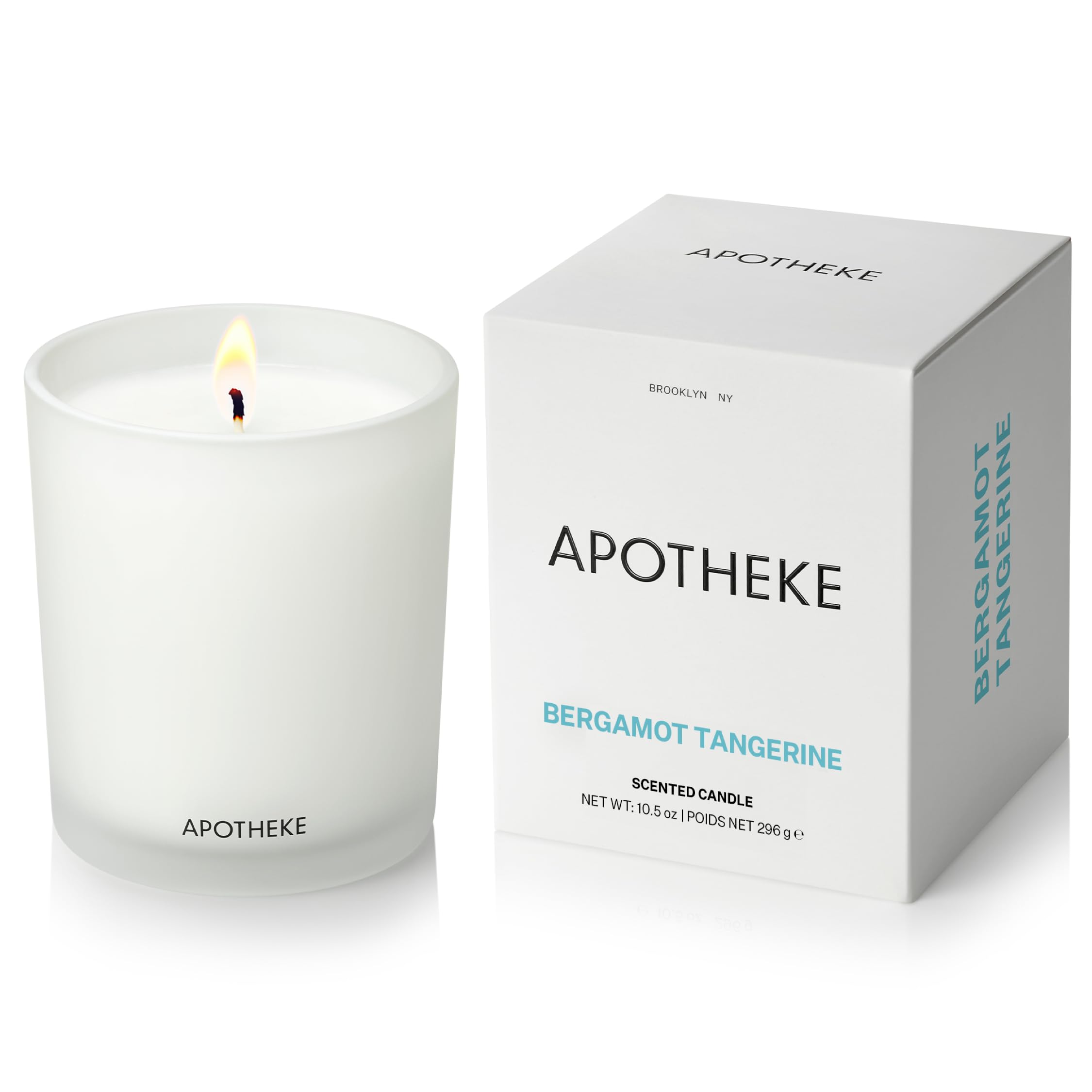 APOTHEKE Bergamot Tangerine candle in a white jar for a bright, long-lasting living room fragrance