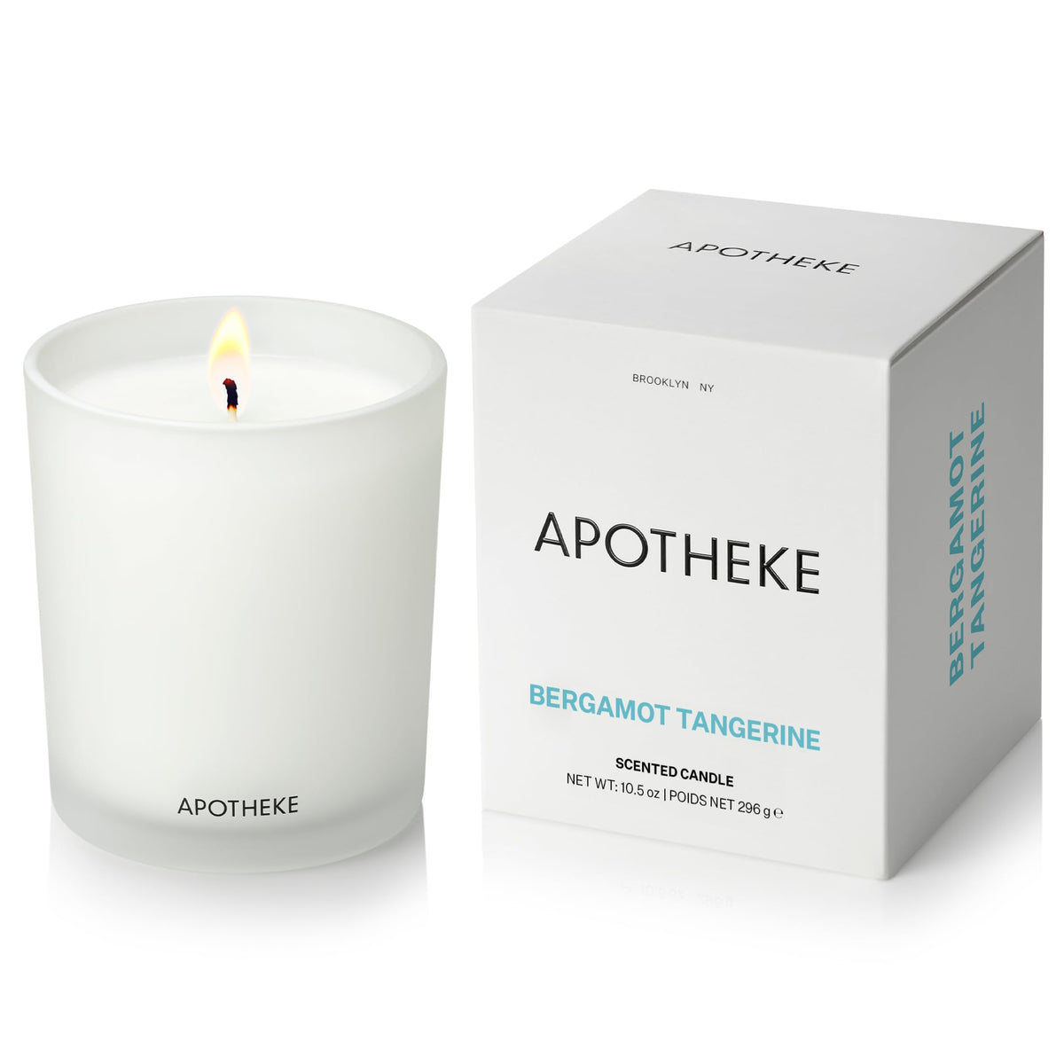 APOTHEKE Bergamot Tangerine candle in a white jar for a bright, long-lasting living room fragrance