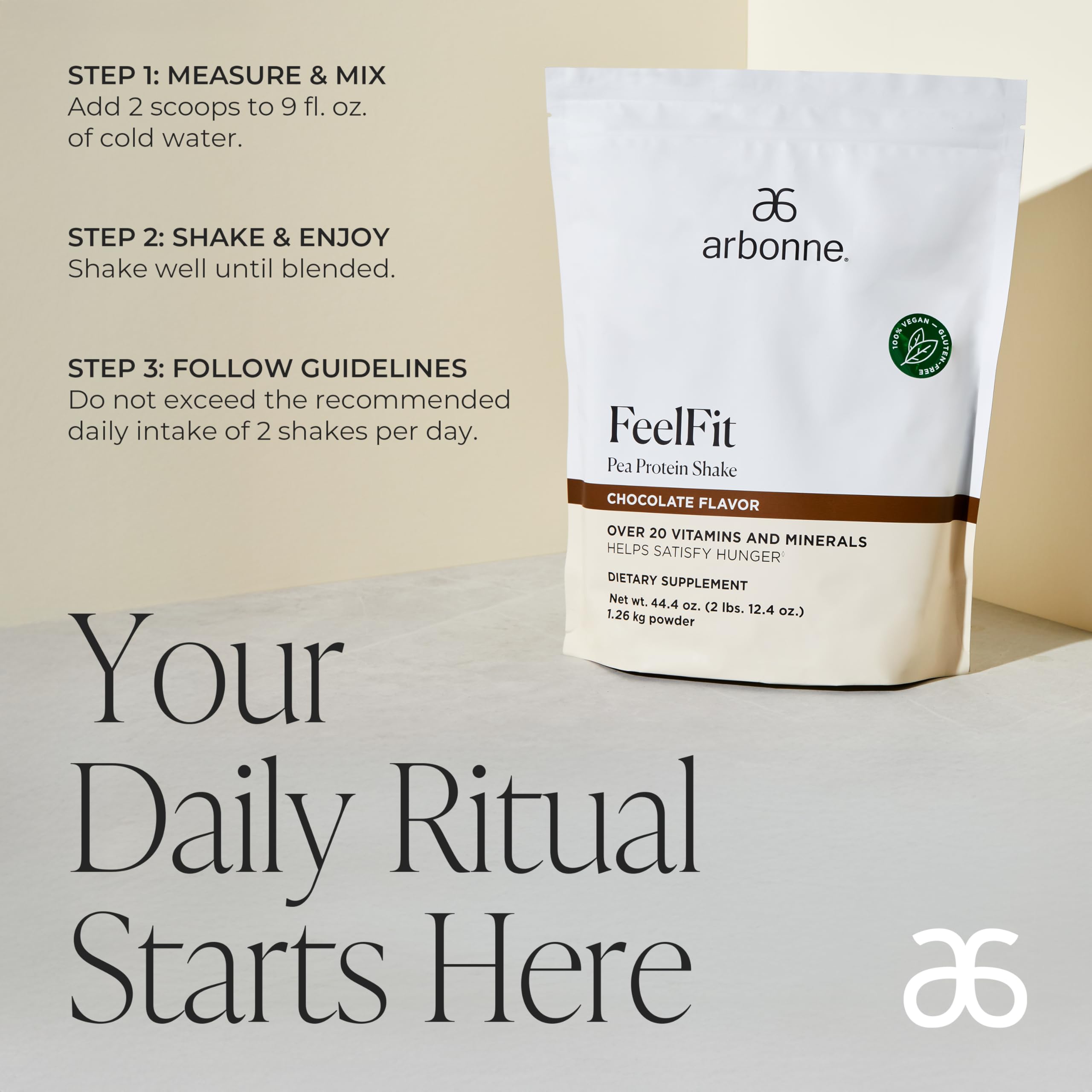 Arbonne Feelfit pea protein shake chocolate glass pour—smooth, dairy-free shake texture.