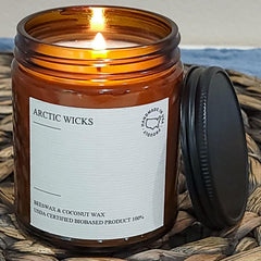 Arctic Wicks coconut-beeswax candle in room setting providing inviting ambience.
