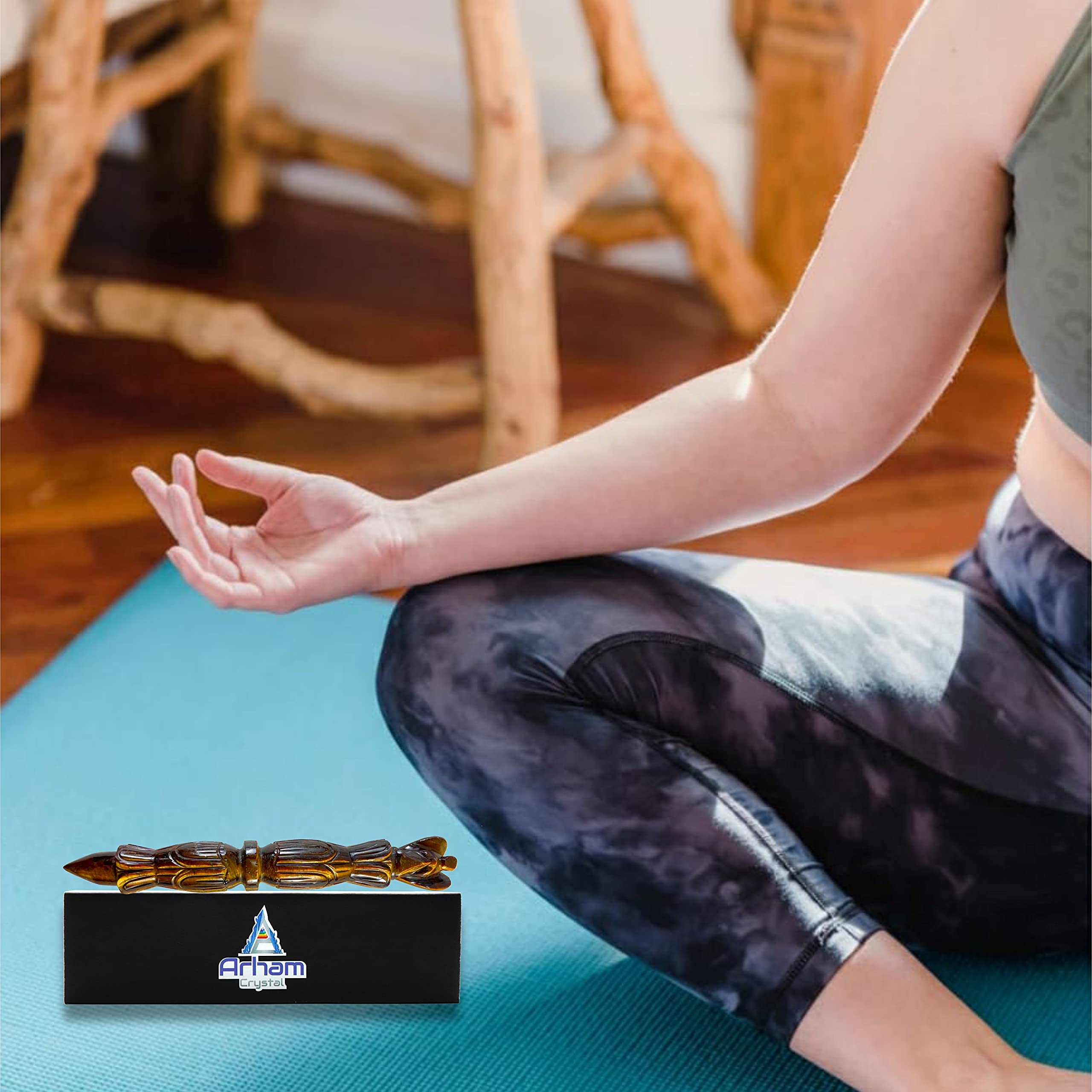 ARHAM CRYSTAL Tiger Eye wand for chakra balancing during practice.
