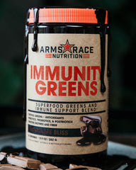 Arms Race Immunity Greens Chocolate Bliss shake in glass showcases delicious taste and convenient nutrition.