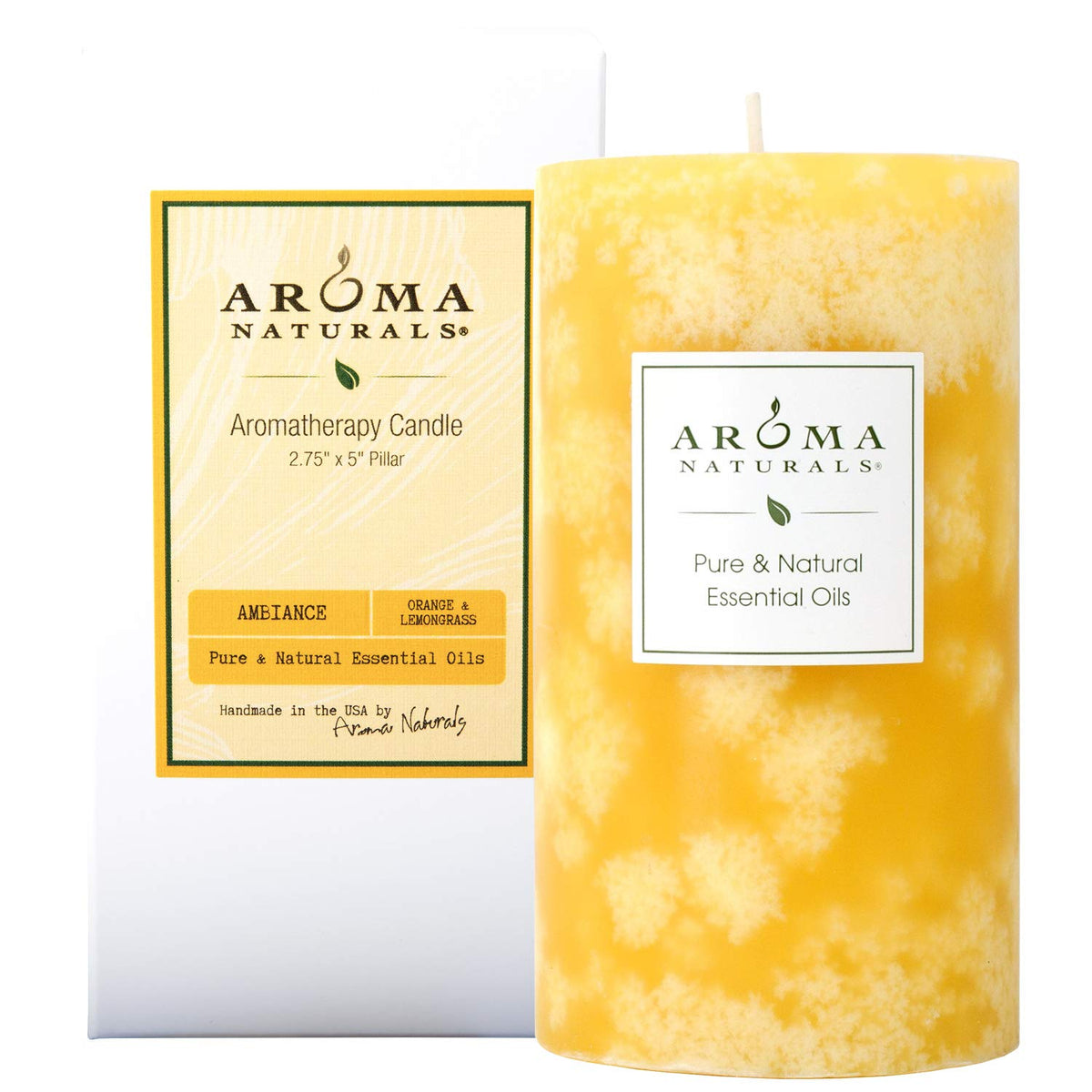 Aroma Naturals orange-lemongrass pillar candle in yellow creates uplifting ambiance with clean-burning essential oils.