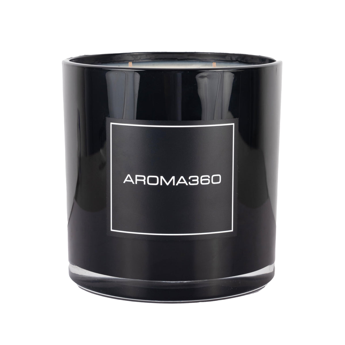 Aroma360 Black Velvet 4-Wick Candle on a chic table adds warm ambiance for living spaces