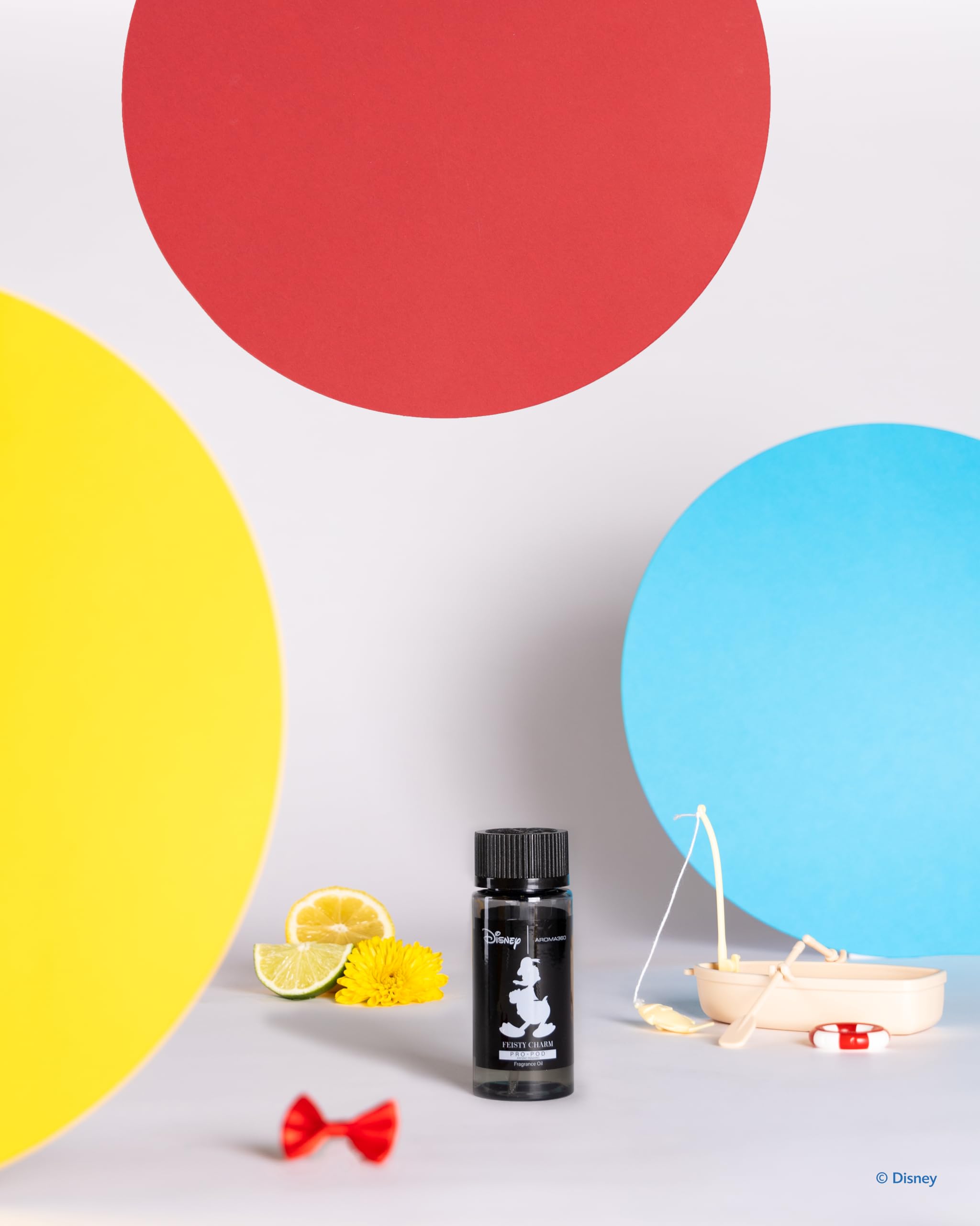 Aroma360 Feisty Charm Pro-Pod closeup highlights blue cedar and cardamom for a calming room scent.