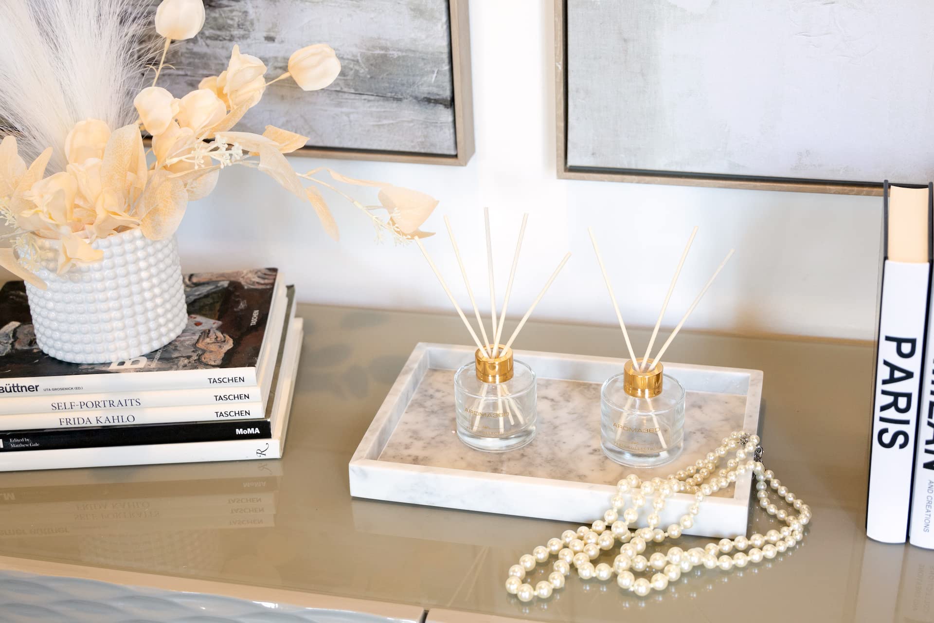 Aroma360 Dream On Paris diffuser on a shelf enhancing decor