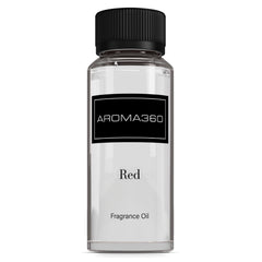Aroma360 Red Diffuser Oil bottle pour releasing ruby grapefruit notes in a cozy living room.