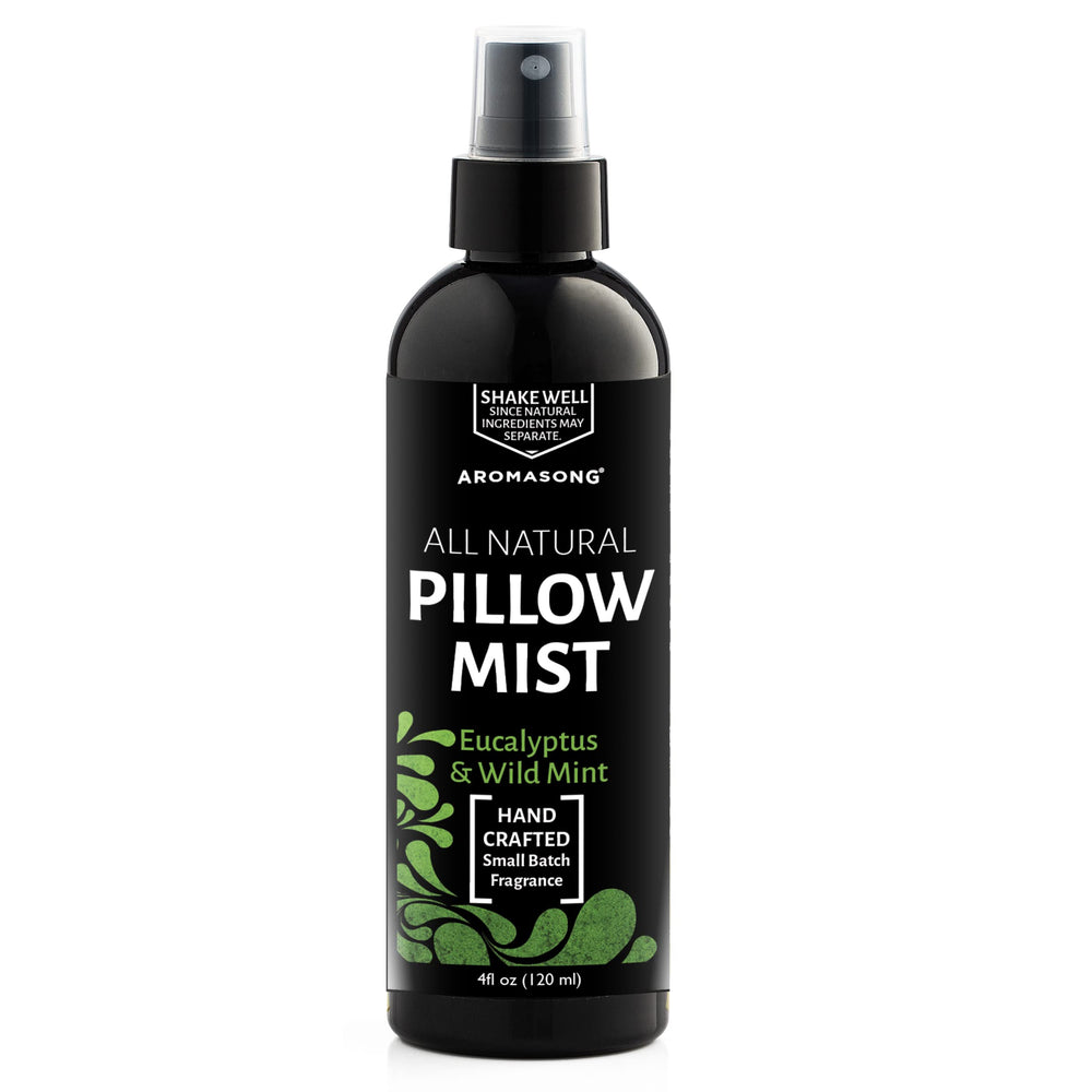 Cozy bedroom scene with Aromasong pillow spray ready.