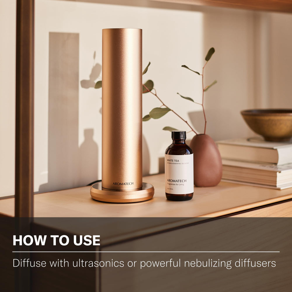 Nebulizing diffuser scene with AromaTech White Tea—bold room-filling aroma.