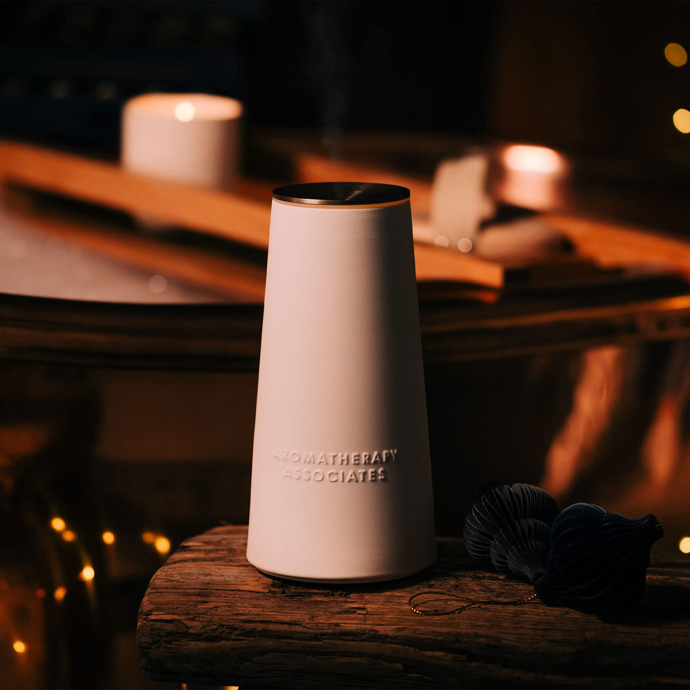 Aromatherapy Associates Atomizer Diffuser on desk, indicating long-lasting battery capability.