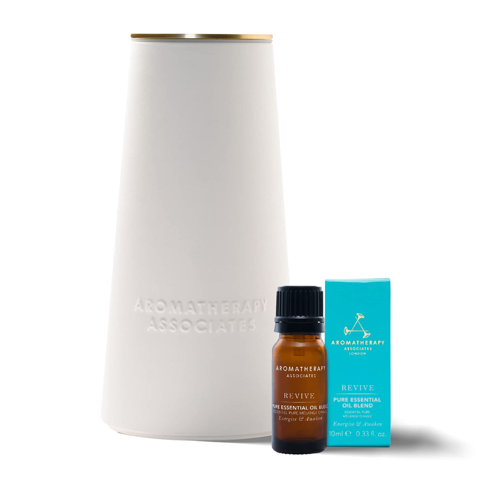 Aromatherapy Associates atomizer diffuser on a nightstand offers subtle fragrance diffusion.