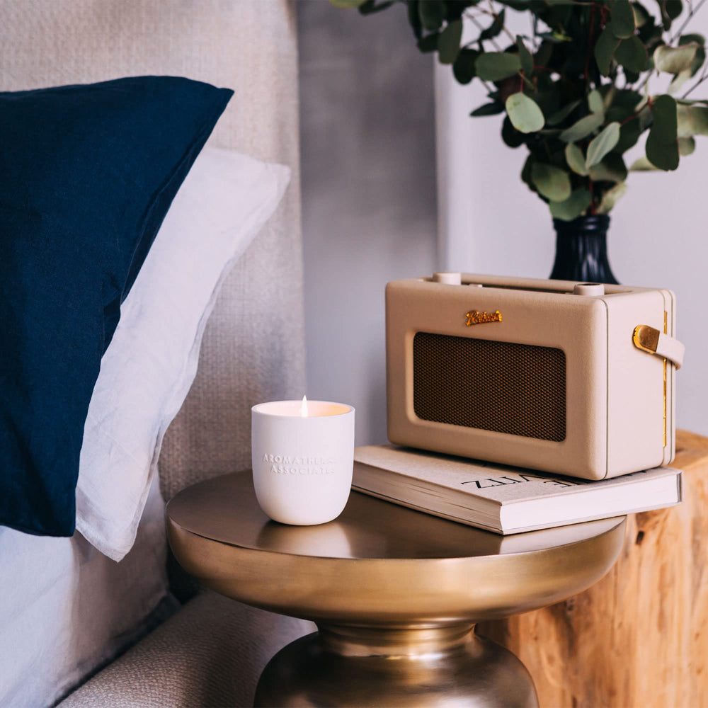 Aromatherapy Associates De-Stress Candle in a chic ceramic holder for luxury ambiance.