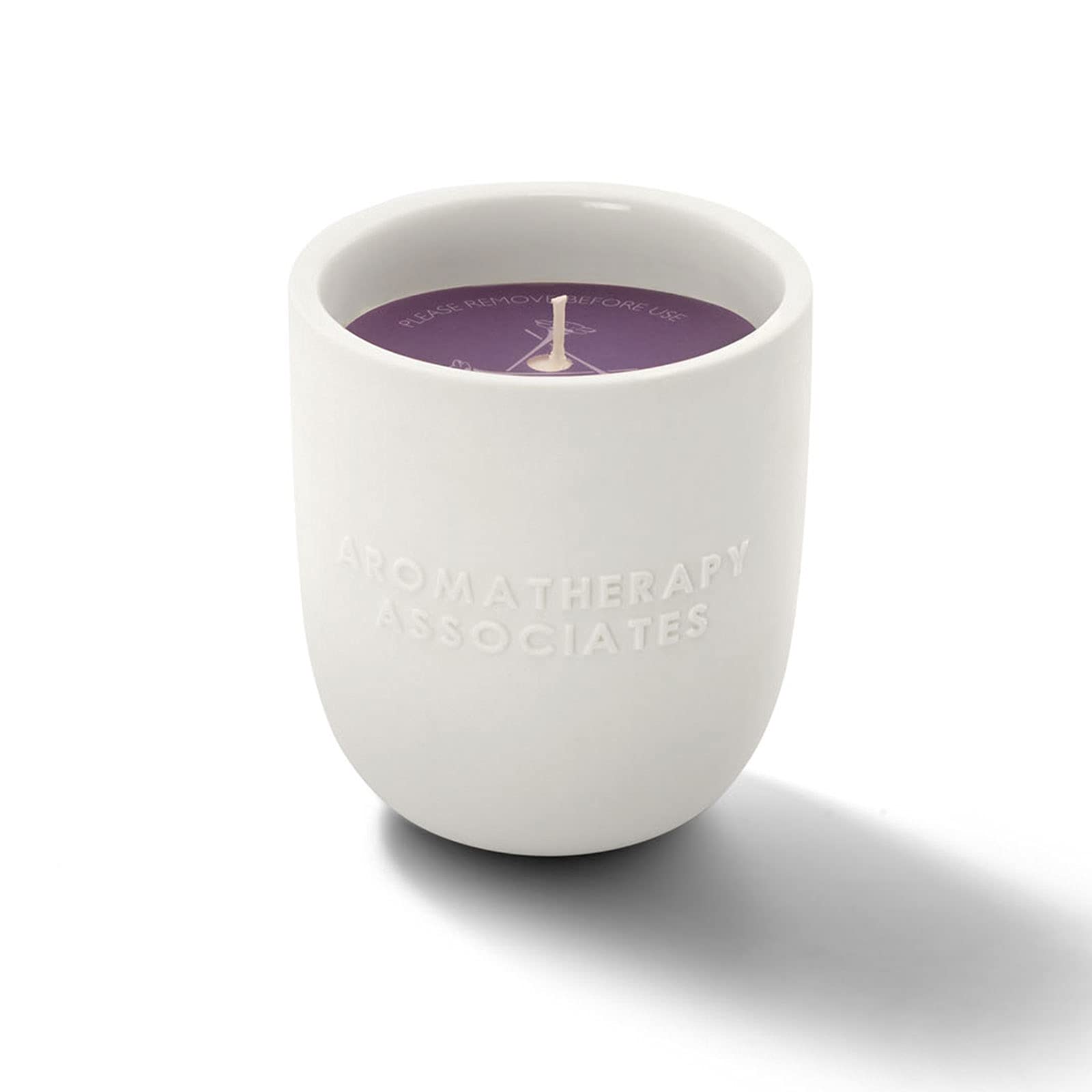 Aromatherapy Associates De-Stress Candle wax being poured to reveal essential oil blend.