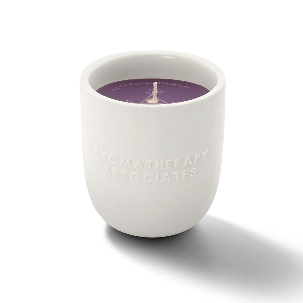 Aromatherapy Associates De-Stress Candle wax being poured to reveal essential oil blend.