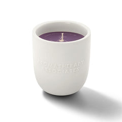 Aromatherapy Associates De-Stress Candle wax being poured to reveal essential oil blend.