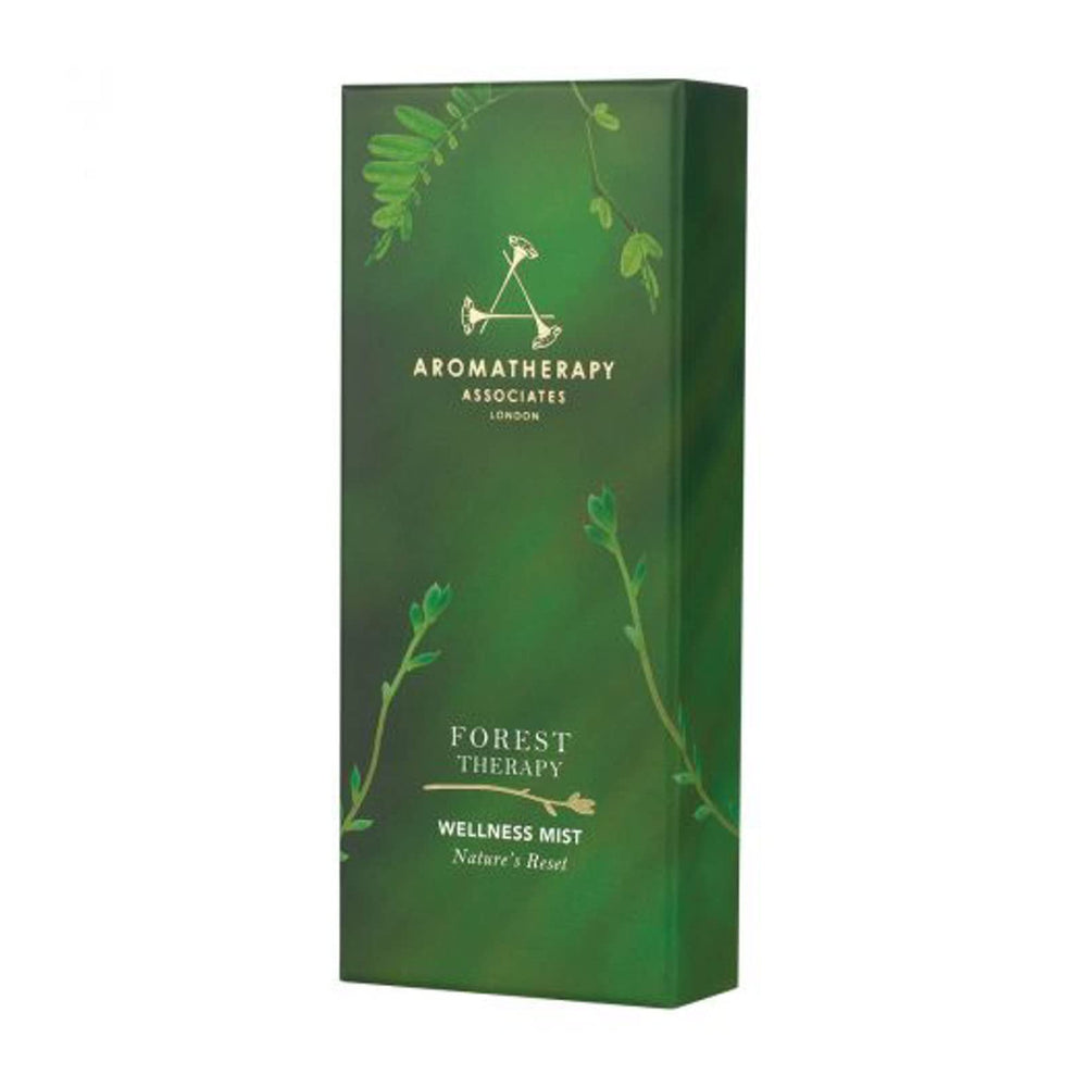 Aromatherapy Associates Forest Therapy Wellness Mist bottle in hand for grounding ritual
