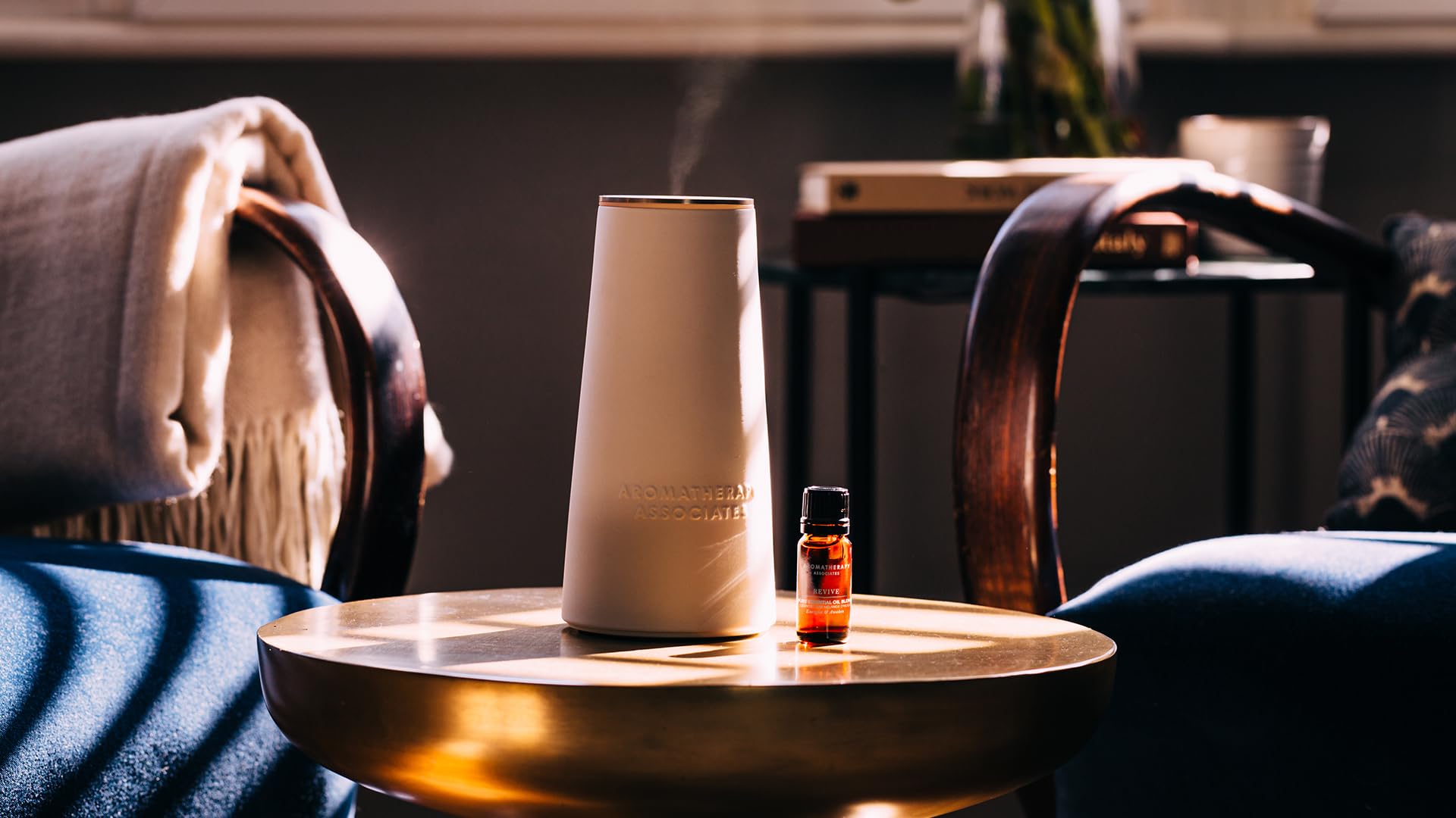 Aromatherapy Associates Revive bottle shows bergamot notes for a citrus lift.