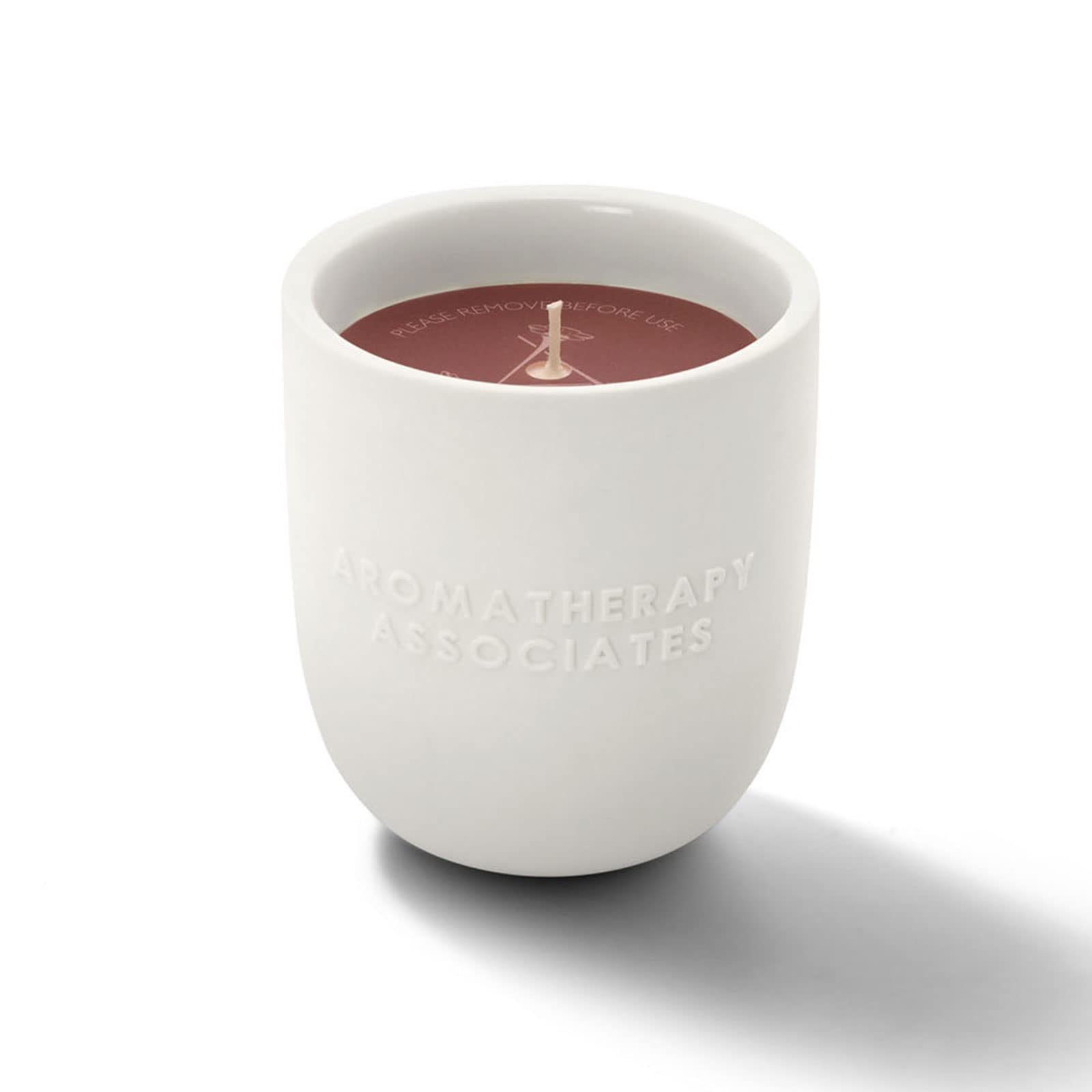Aromatherapy Associates Rose Candle close-up showing Damask rose and geranium aroma for relaxation.