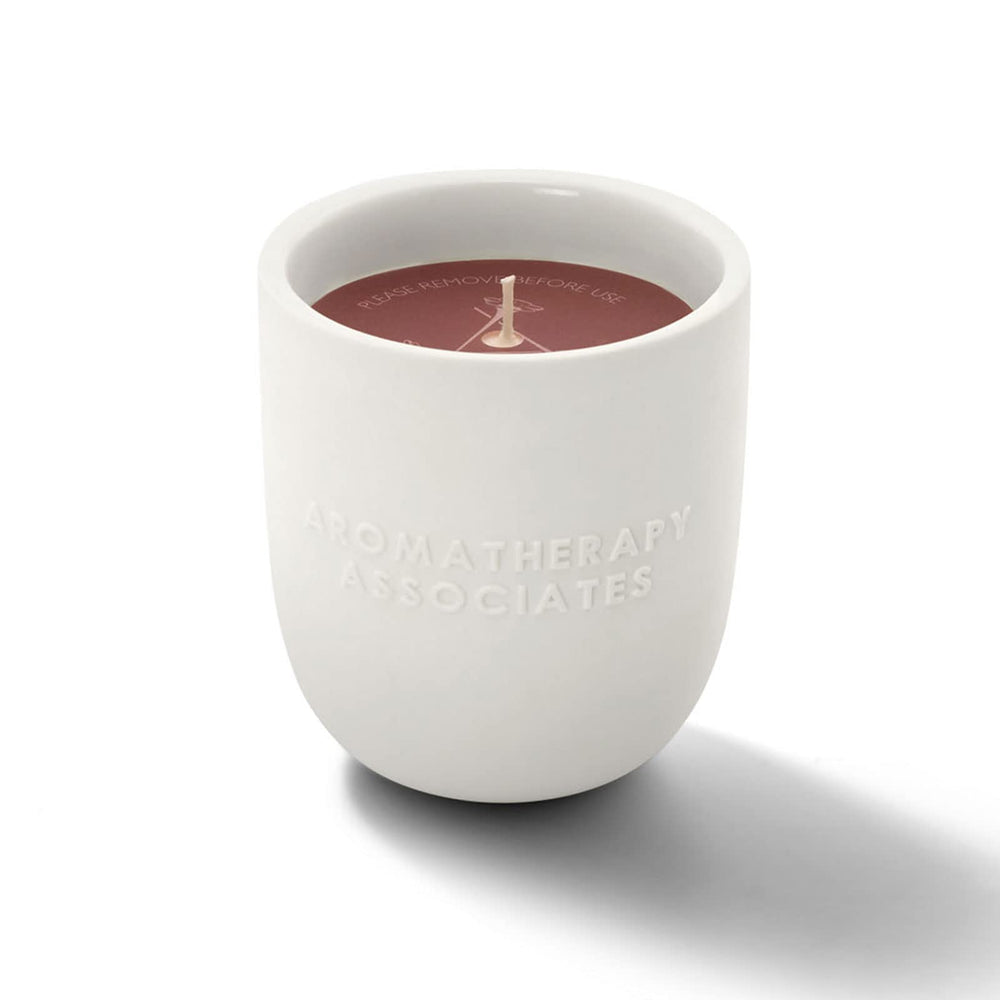 Aromatherapy Associates Rose Candle close-up showing Damask rose and geranium aroma for relaxation.