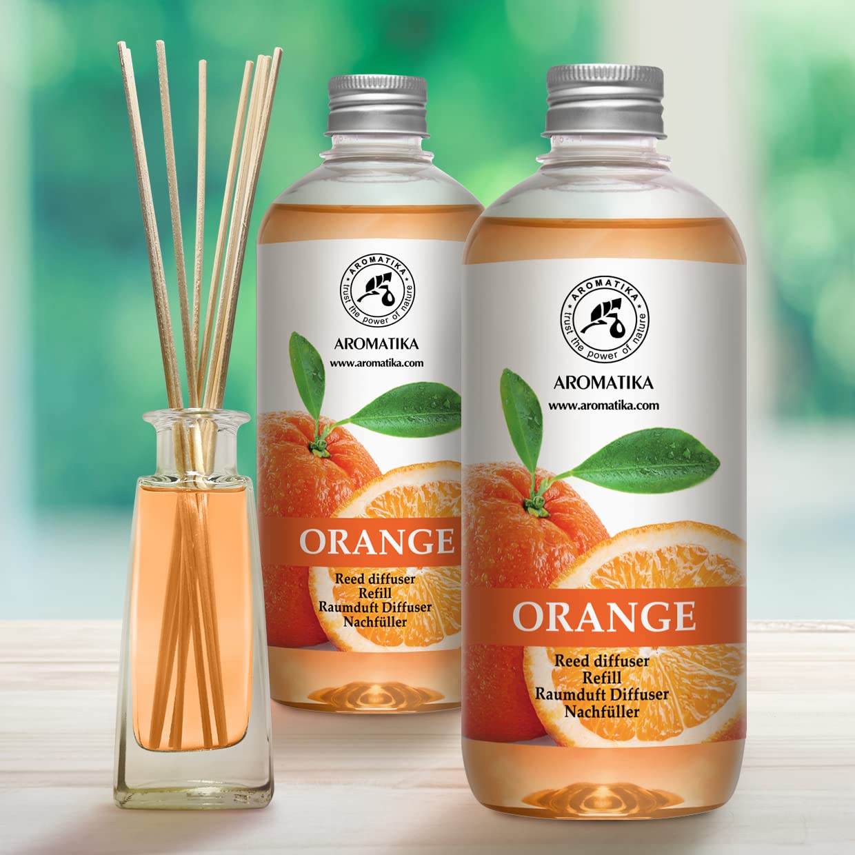 AROMATIKA orange diffuser bottle with sticks ready to scent a space