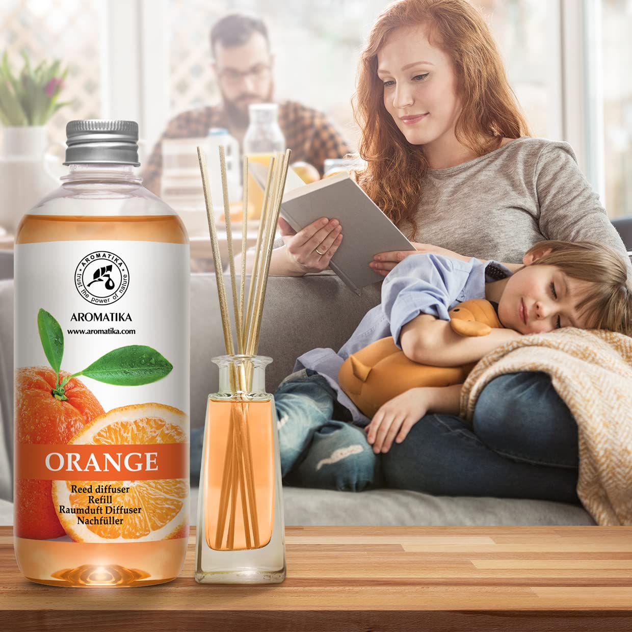AROMATIKA diffuser setup in a cozy living room emitting cheerful scent
