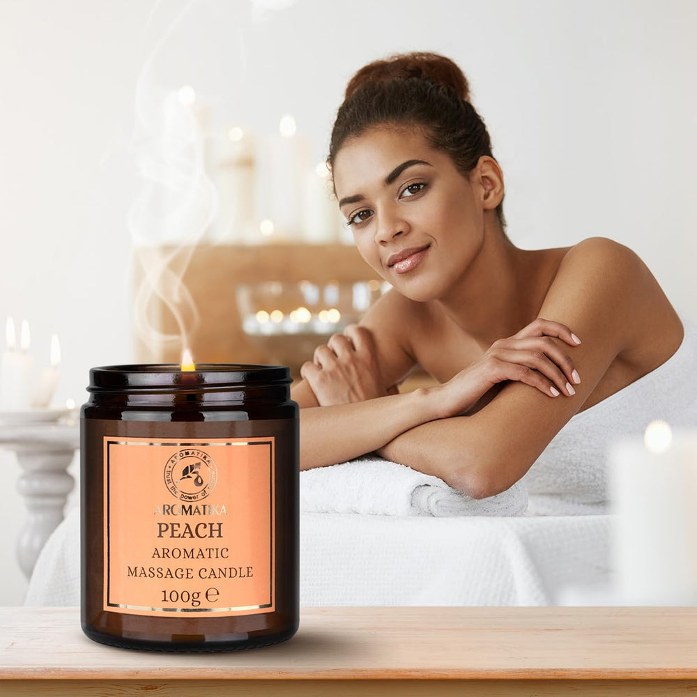 AROMATIKA Peach massage candle application promotes smooth glide and relaxing body care.
