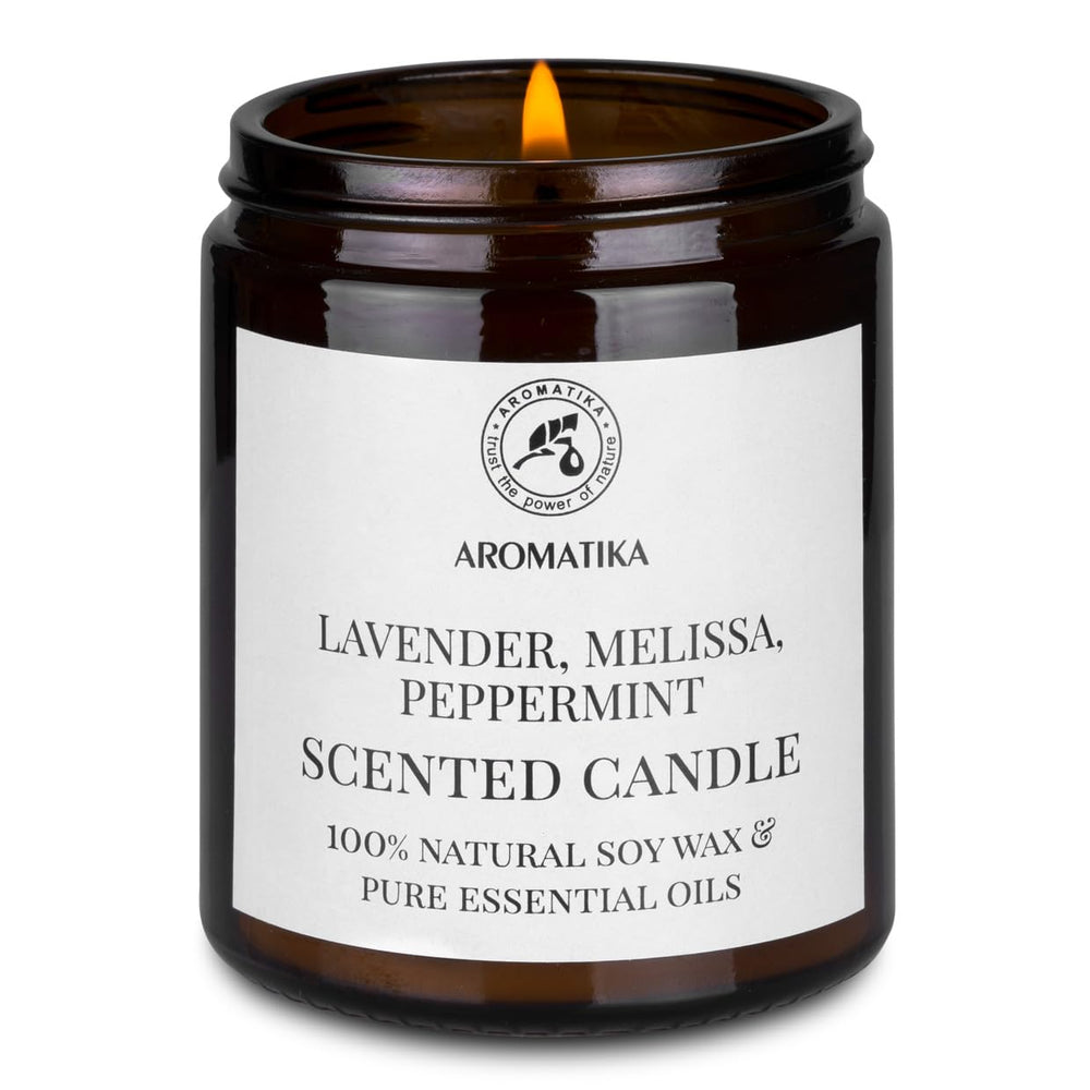 AROMATIKA peppermint scented candle in glass jar for uplifting spaces.