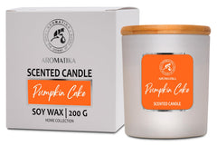 AROMATIKA Pumpkin Cake scented candle in glass jar for a cozy autumn ambiance.