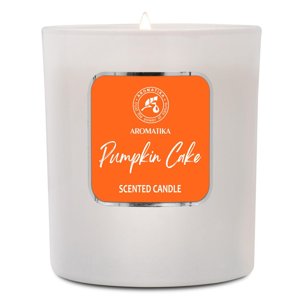 AROMATIKA Pumpkin Cake candle lit for cozy evenings at home.