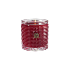 Aromatique The Smell of Christmas candle in a jar on a cozy shelf, inviting holiday warmth.