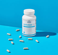 Aminolase TPA capsules ready to mix into a shake for absorption.
