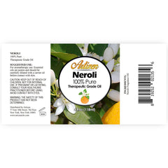 Artizen Neroli oil glass bottle glowing under light, protecting purity and potency.
