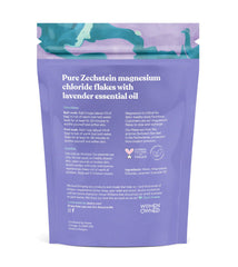 ASUTRA lavender bath flakes dissolving in warm water for aromatherapy calm.