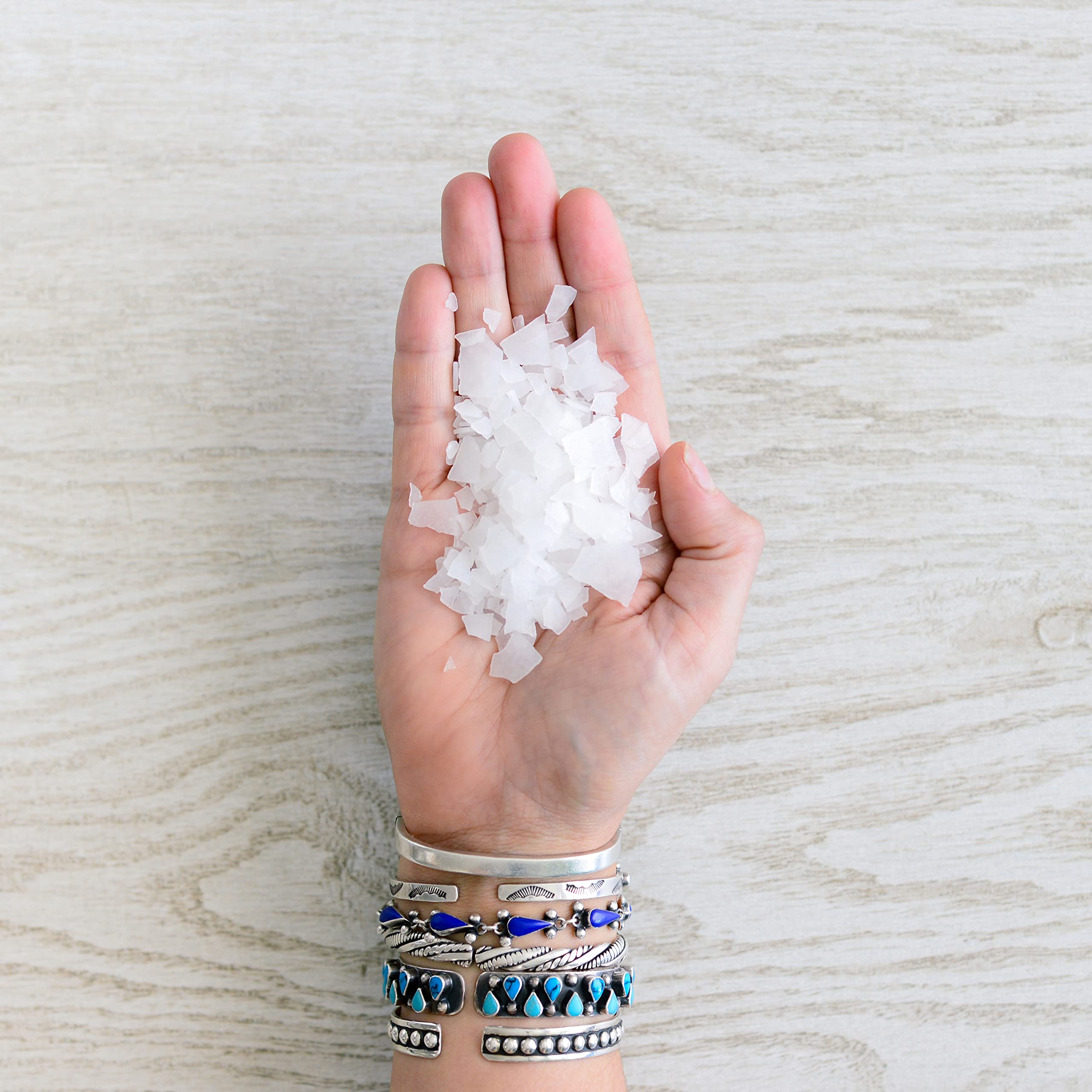 ASUTRA Magnesium Chloride Bath Flakes dissolving texture indicates rapid absorption in warm water.